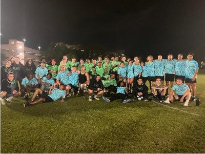 Jacksonville University Students in football field at night